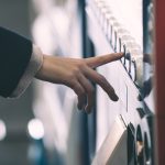 Woman,buying,with,a,vending,machine